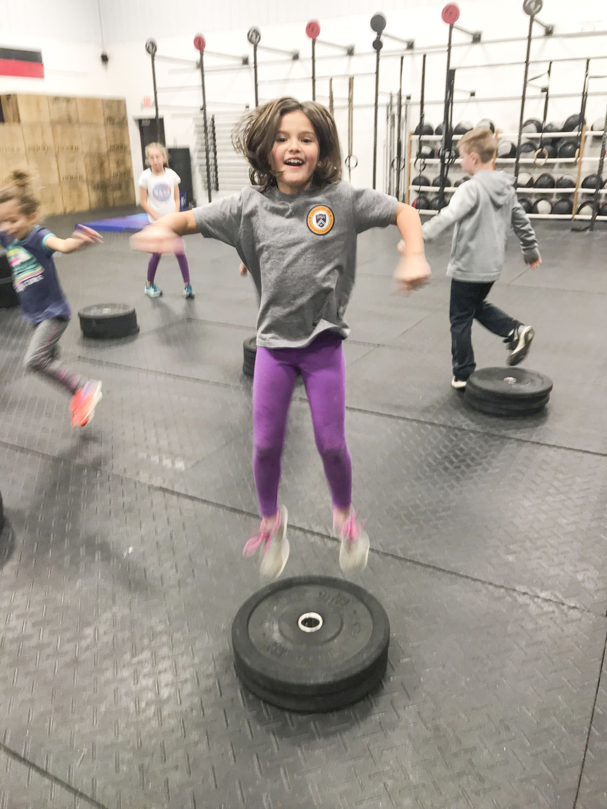 Kids play during a recent CrossFit Kids program at the local CrossFit Pallas gym.